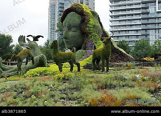 Plant sculpture Mother Earth with modern buildings behind, Mosaicanada Exhibition, Gatineau, Quebec Province, Canada, North America.