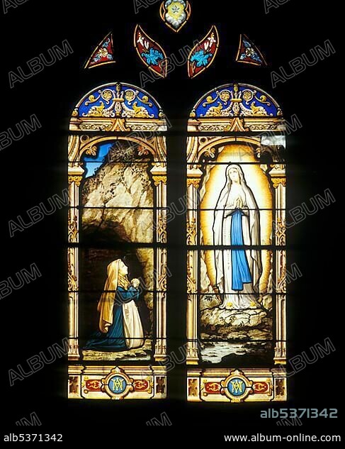 Stained-glass window depicting the Virgin Mary appearing before St. Bernadette, Soubirous, Parish Church of St. Amand Montrond, Cher Department, France, Europe.