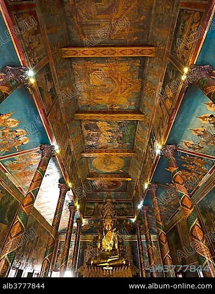 Bronze Statue and ceiling paintings, Buddha statue in the temple Phnom Penh, Cambodia, Asia.