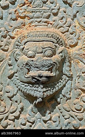 Sandstone bas-relief depicting a demon supposed to protect the temple and scare evil spirits away, Bakong Temple, Roluos Group, Angkor, Cambodia, Southeast Asia, Asia.