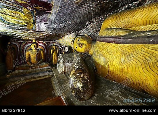 Buddha statues and murals in one of the cave temples of the Golden Temple, UNESCO World Heritage Site, Dambulla, Central Province, Sri Lanka, Asia.