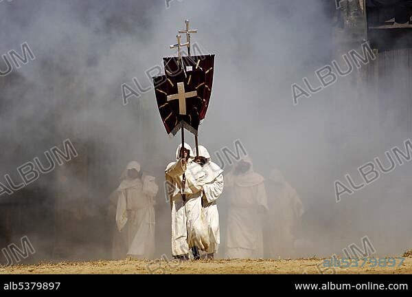 Monks in white cowls carries red flags with cross are befog, knight festival Kaltenberger Ritterspiele, Kaltenberg, Upper Bavaria, Germany, Europe.