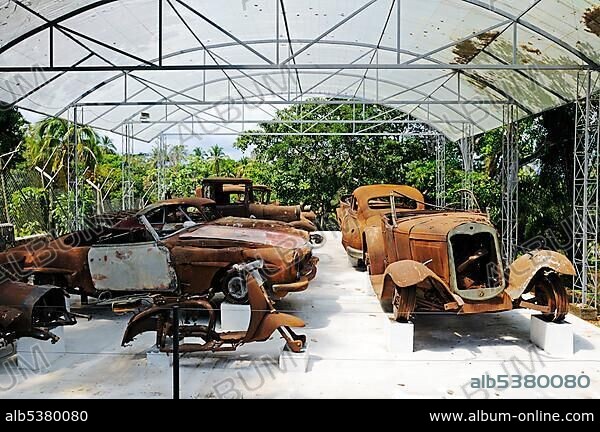 Burnt out cars, fleet, Museum at the Hacienda Napoles, former estate of drug baron Pablo Escobar, head of the Medellin Cartel, Puerto Triunfo, Antioquia, Colombia, South America.