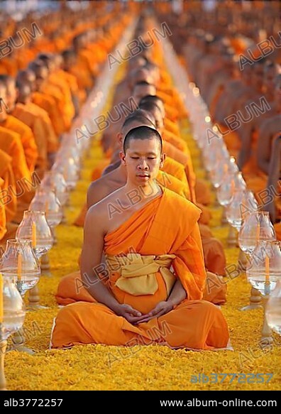 Monks sitting in a row meditating Wat Phra Dhammakaya Temple