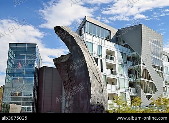 Modern facades of the Museum Residences, residential buildings in the Civic Center Cultural Complex, with a granite sculpture at the front, Denver, Colorado, USA, PublicGround, North America.