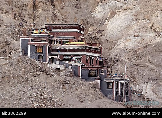 Tibetan temple and monastery complex built in Sakya architecture and painting on a mountain slope, Sakya, Central Tibet, Tibet, China, Asia.