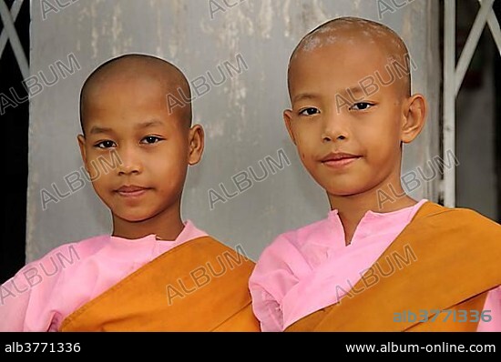 Two young girls, young Buddhist child nuns, historic centre, Yangon, Rangoon, Myanmar, Burma, Southeast Asia, Asia.