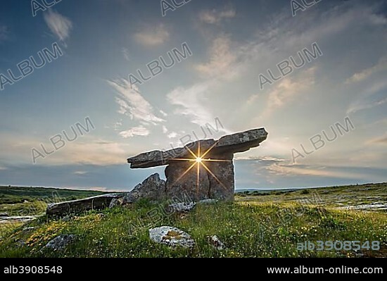 The Poulnabrone Dolmen with Sun Star, Pre-Historic Stone-chamber Grave or Portal Tomb, Burren, County Clare, Republic of Ireland.