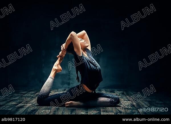 Young woman practicing yoga One-legged king pigeon pose Stock Photo | Adobe  Stock