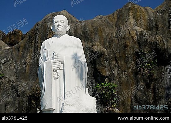 Buddha statue in front of rocks, landmark in Nha Trang, Vietnam, Southeast Asia, Asia.