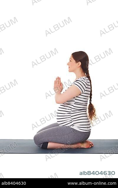 A pregnant woman sitting in a yoga pose Image & Design ID 0000147037 -  SmileTemplates.com