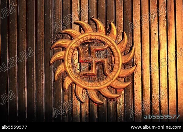 India, the sun wheel, a swastika, lucky charm, is a cross symbol with bent or curved arms, sun sign of the sun deity, North India, India, Asia.