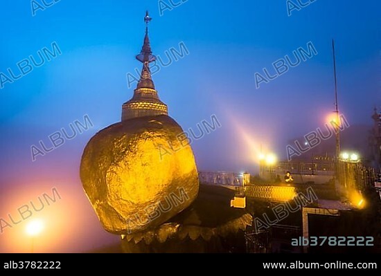 Golden Rock at dusk with Kyaiktiyo Pagoda, Kyaikto, Thaton District, Mon State, Myanmar, Myanmar, Asia.