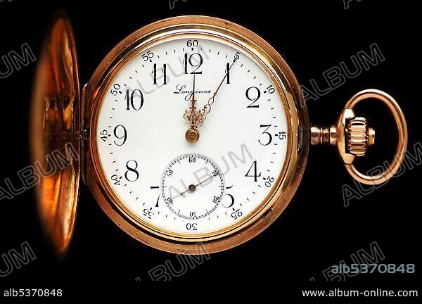 Clock face of an antique golden pocket watch brand LONGINES