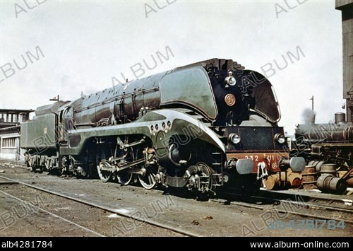 Hudson 232 U 1 steam locomotive, in an SNCF depot.. 1948.