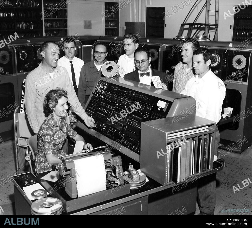 UNIVAC made its last run at Lawrence Livermore National Laboratory  in December 1959. By then, the Laboratory had acquired more powerful IBM computers, capable of 15,000 additions per second. The last Univac run was done by Jonnie Daw, seated. Standing left to right are Stan Helmeci, Ed Lafranchi, Cedric Eastburn, Marv Lehman, Sid Fernbach, Pierre Noyes, and John Hudson. Fernbach was head of computing at Livermore, and a pioneer in developing and applying high-performance computers to solve large scientific problems. No photographer credited, dated December 1959.