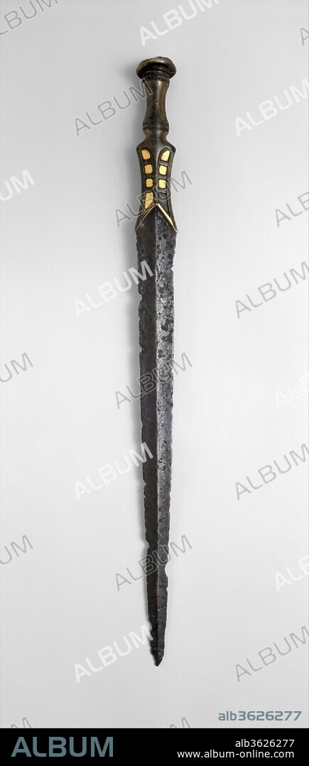 Short Sword (Duan Jian). Culture: Eastern Central Asia. Dimensions: L. 26 3/8 in. (67 cm); W. 2 in. (5.1 cm); Wt. 1 lb. 6.5 oz. (637.9 g). Date: ca. 4th-1st century B.C..
From its inception in the third millennium B.C., the sword served equally as a weapon and as a symbol of social status and power. During the first millennium B.C., in the hands of the nomadic peoples of the Eurasian steppes, it became, along with the bow, one of the primary cavalry weapons of the ancient world. Groups such as the Scythians, the Yuezhi, the Xiongnu, and the Xianbei achieved a succession of federations and kingdoms in Eurasia by combining the use of sword and bow with an unparalleled skill in horsemanship. Archaeological investigations of burial sites have established the importance of the sword both as a valued possession and a sign of rank in various nomadic societies. While burial context has made it possible to identify some types of swords with specific nomadic peoples, others, like this example, are difficult to attribute with certainty. The complex techniques required for the manufacture of this sword, the combined use of bronze and steel, and the presence of gold decoration all indicate its origin in a society with advanced metalworking skills and a relatively high level of material wealth. Swords similar to this one have been found in Yunan in southwestern China and in Ningxia in the northwest. The Ningxia finds also include many other examples of similarly advanced metalworking, suggesting that this sword may have originated in that region, perhaps around the time of the late Warring States period.