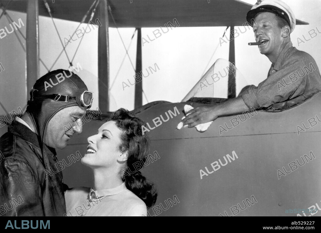 DAN DAILEY, JOHN WAYNE and MAUREEN O'HARA in THE WINGS OF EAGLES, 1957, directed by JOHN FORD. Copyright M.G.M.