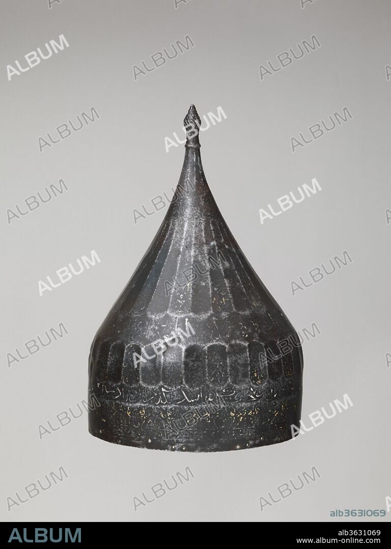 Helmet. Culture: Iranian. Dimensions: H. 12 3/8 in. (31.4 cm); Diam. 8 1/2 in. (21.6 cm); Wt. 2 lb. 7.9 oz. (1131.1 g). Date: probably 15th century.
The inscription around the rim is very worn but reads in part: "He may protect." The helmet is engraved with the mark of the Ottoman arsenal, indicating that it was captured in battle or taken as booty.