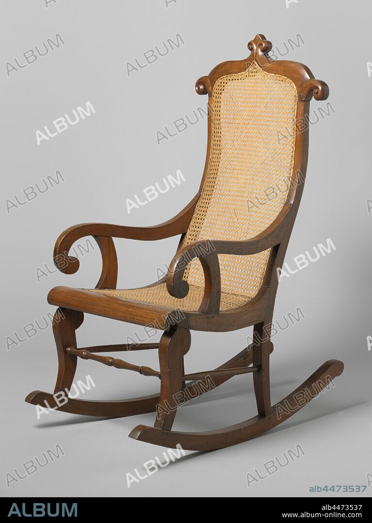 Rocking chair made of djati wood covered with reeds Rocking