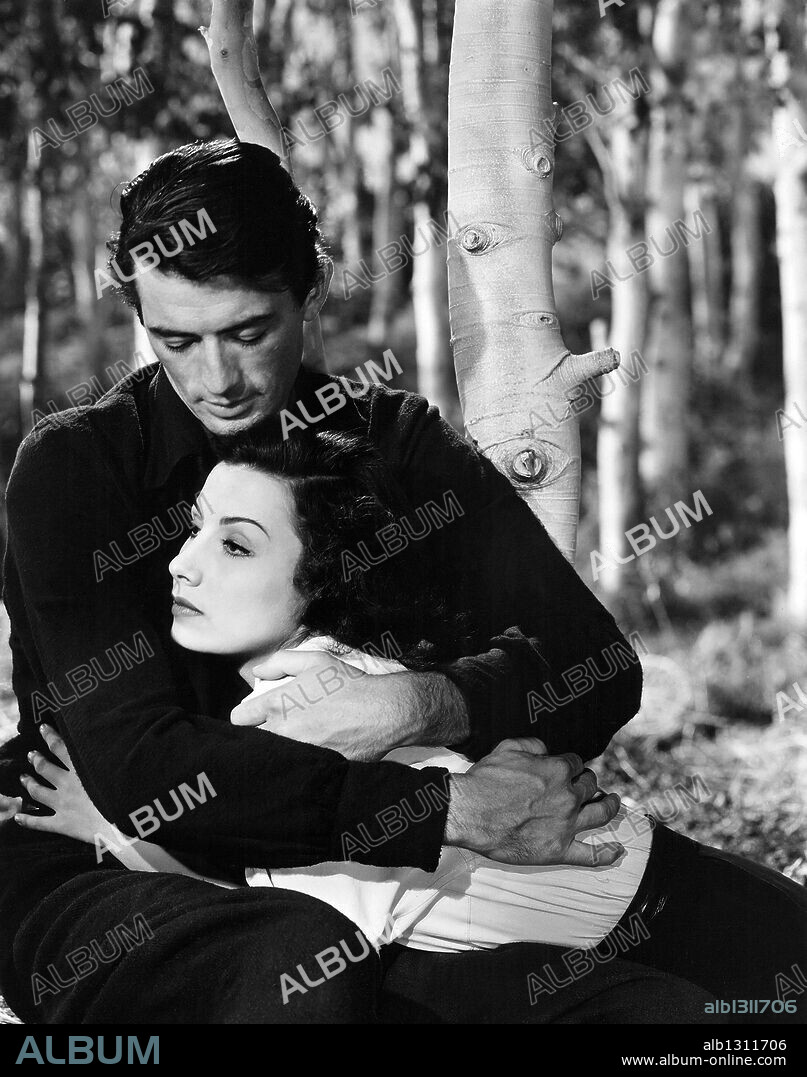 GREGORY PECK and TAMARA TOUMANOVA in DAYS OF GLORY, 1944, directed by JACQUES TOURNEUR. Copyright RKO.