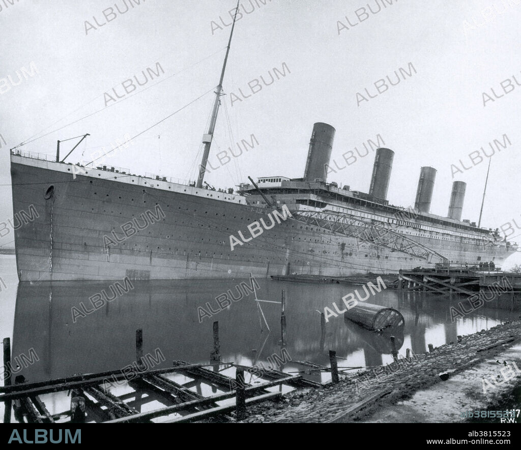 The Titanic during outfitting at the Harland and Wolff shipyard, Belfast, Ireland. RMS Titanic, the largest ocean liner ever built at the time, was reputed to be unsinkable. However, during its maiden voyage it struck an iceberg in the North Atlantic on the night of 14 April 1912 and sank with the loss of 1517 lives.