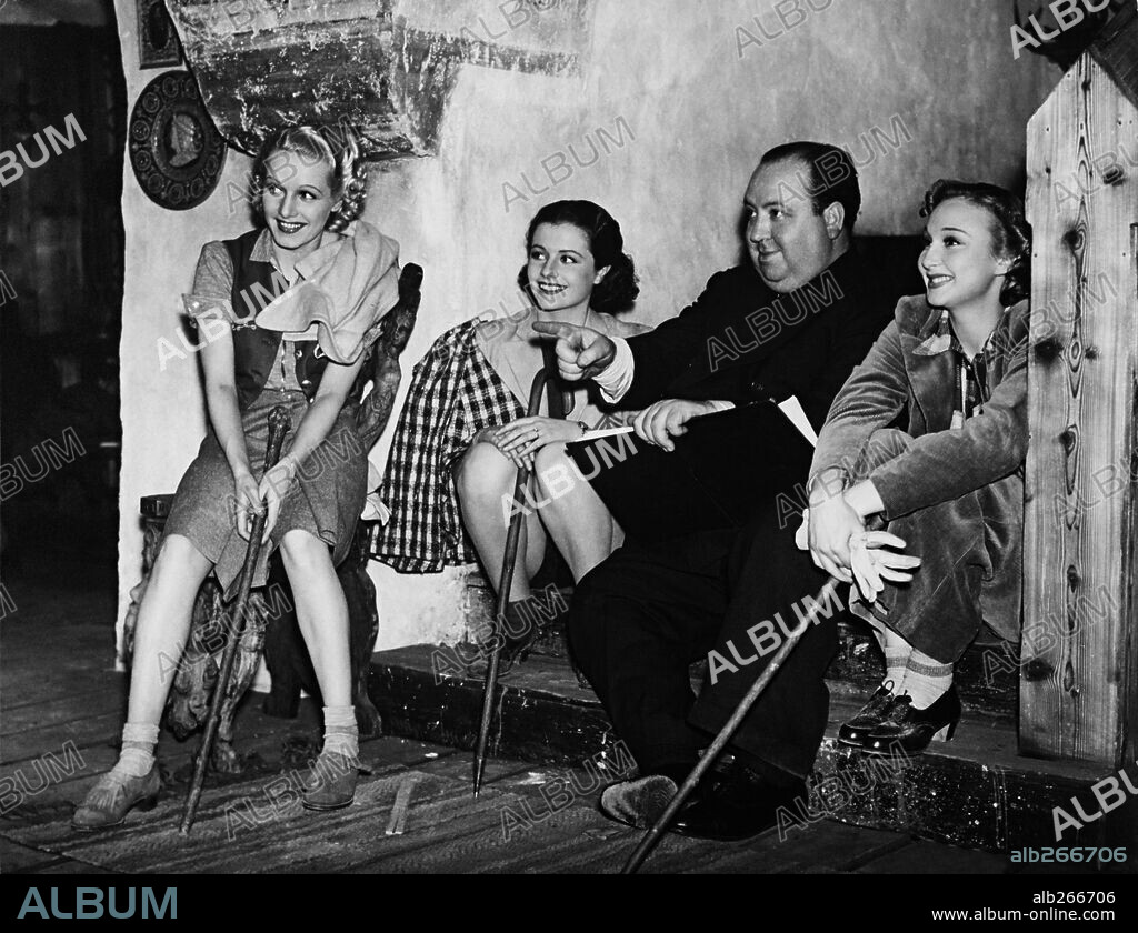 ALFRED HITCHCOCK, GOOGIE WITHERS, MARGARET LOCKWOOD and SALLY STEWART in THE LADY VANISHES, 1938, directed by ALFRED HITCHCOCK. Copyright GAINSBOROUGH FILMS.