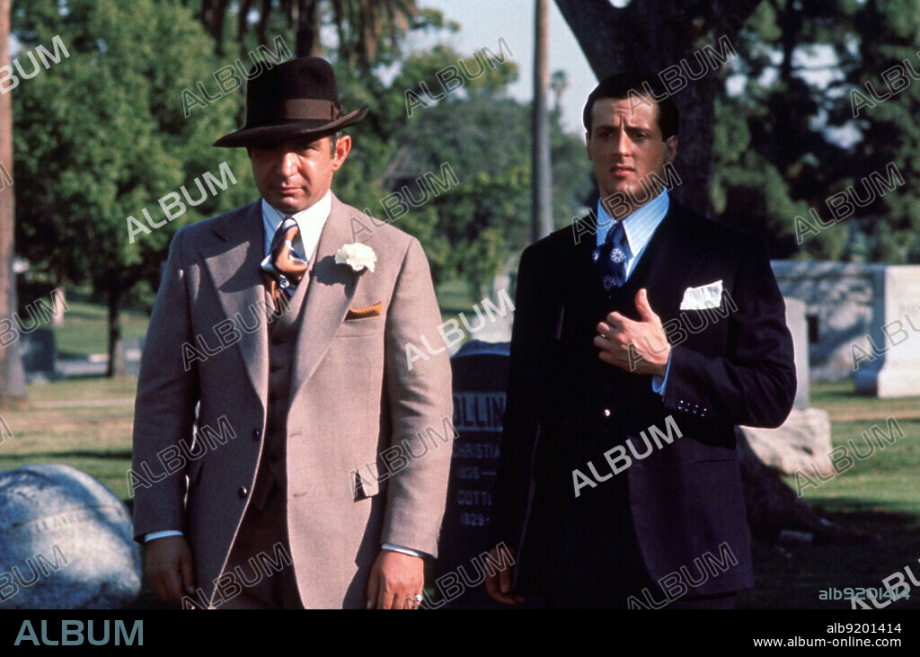 AL CAPONE, BEN GAZZARA and SYLVESTER STALLONE. BEN GAZZARA and SYLVESTER STALLONE in CAPONE, 1975, directed by STEVE CARVER. Copyright ROGER CORMAN/20TH CENTURY FOX.