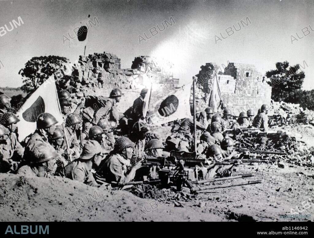 Tientsin-Purow Front. This photograph shows Japanese soldiers defending and artillery battered position in a chinese village on Tientsin-Pukow Front.