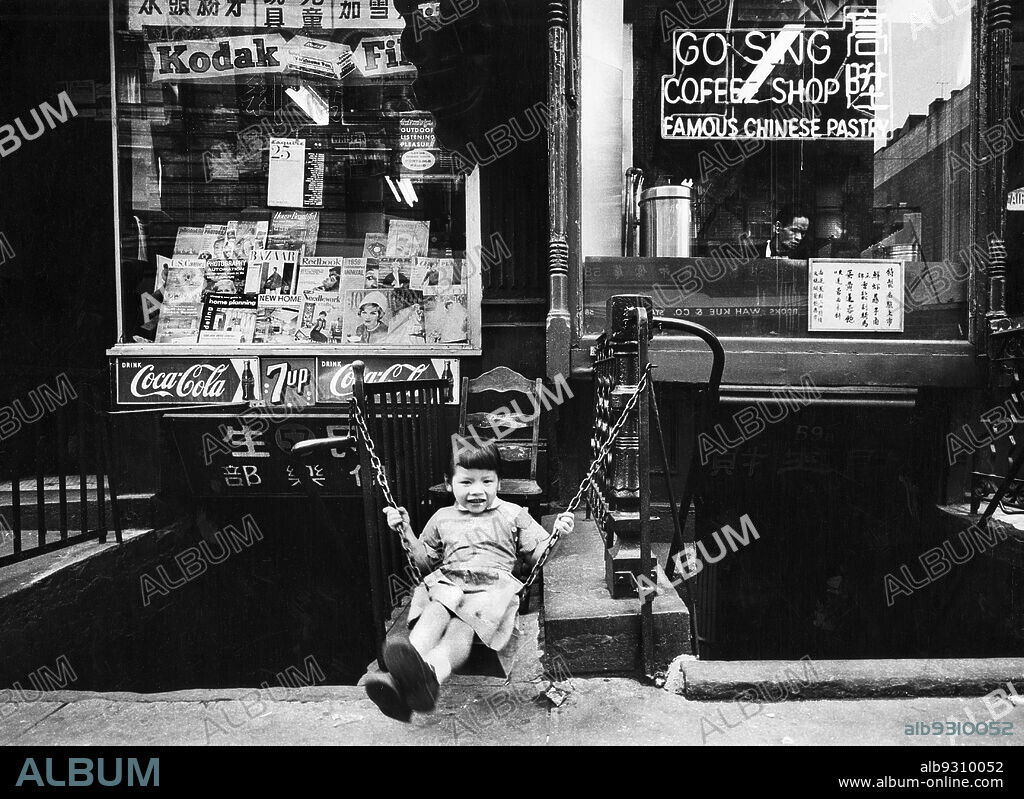 Young Girl Swinging in front of Go Sing Coffee Shop, Chinatown, New York  City, New York, USA, Angelo Rizzuto, Anthony Angel Collection, September  1958 - Album alb9310052