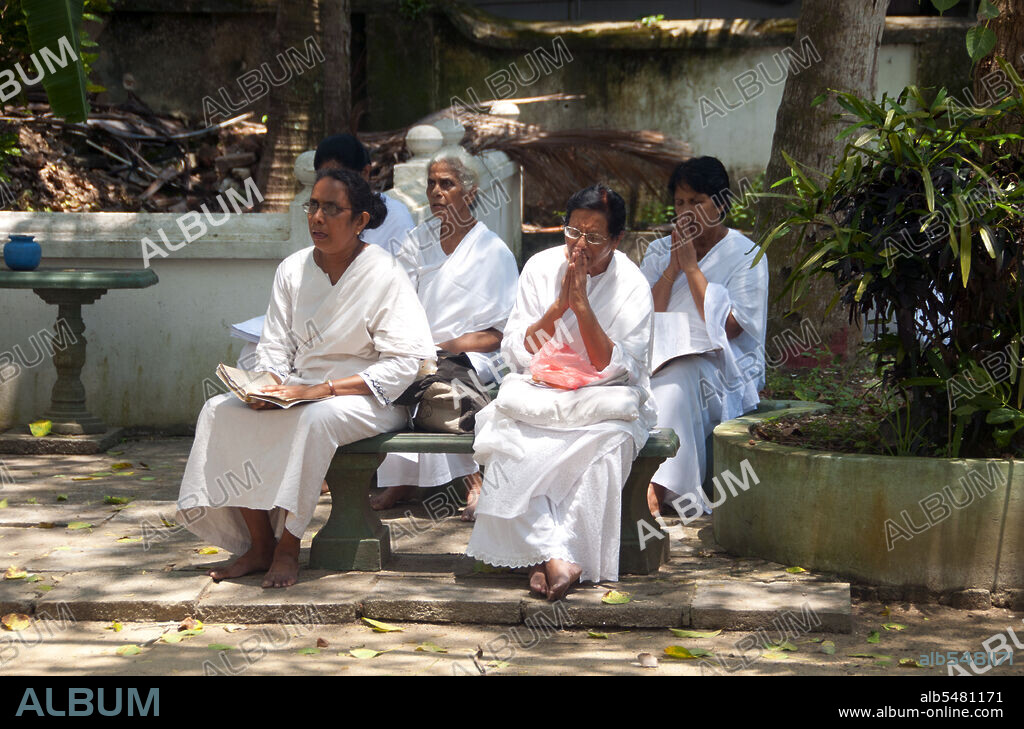 Devotees at a Buddhist temple in Mount Lavinia, south of Colombo ...