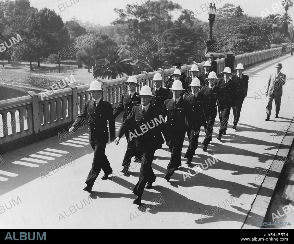 Police Step Out in New Uniforms Melbourne saw the new-style police uniforms for the first time when this batch of young constables marched through the city today from the training depot in St. Kilda Road to police headquarters. After a duty parade inspection at Russell Street, the men were allotted their barracks quarters. Tomorrow they will be drafted to the traffic branch for duty. One of the youngest of them. Constable R. G. Williams, of Caulfield, not yet 21, was wearing two rows of war service ribbons and several rosettes on his jacket. He served round the world in the Royal Navy for nearly six years in the Second World War. March 12, 1947.