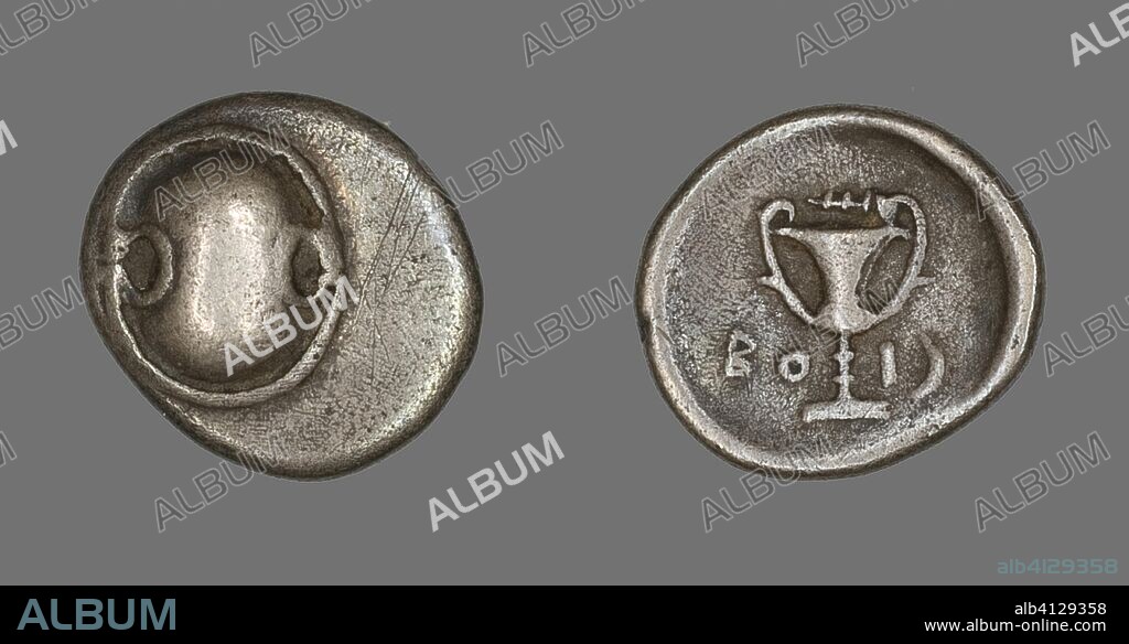 ANCIENT GREEK. Hemidrachm (Coin) Depicting a Boeotian Shield. Greek. Date: 338 BC-315 BC. Dimensions: Diam. 1.6 cm; 2.53 g. Silver. Origin: Thebes.