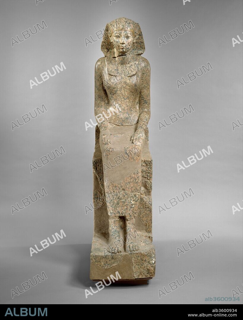 The Female Pharaoh Hatshepsut. Dimensions: H. 170 × W. 41 × D. 90 cm, 620.5 kg (66 15/16 × 16 1/8 × 35 7/16 in., 1368 lb.) (as reassembled). Dynasty: Dynasty 18. Reign: Joint reign of Hatshepsut and Thutmose III. Date: ca. 1479-1458 B.C..
This graceful, life-size statue depicts Hatshepsut in female attire, but she wears the nemes headcloth, a royal attribute usually reserved for the reigning king. In the columns of text inscribed beside her legs on the front of the throne, she has already adopted the throne name Maatkare, but her titles and epithets are still feminine. Thus, she is "Lady of the Two Lands" and "Bodily Daughter of Re." On the back of the throne, part of an enigmatic scene is preserved which probably consisted of two back-to-back goddesses. The goddess has the body of a pregnant hippopotamus with feline legs and a crocodile tail appears behind her legs. Although this resembles Taweret, the goddess who protects women and children, it is probably Ipi, a royal protector who appears in the same position on a statue of the Seventeenth Dynasty king Sebekemsaf I (ca. 1575 B.C.) in the British Museum.
In the early 1920s the Museum's Egyptian Expedition excavated numerous fragments of the statue near Hatshepsut's temple at Deir el-Bahri in western Thebes. The torso, however, had been found in 1869 and was in the Rijksmuseum van Oudheden in Leiden. In 1998, the Leiden torso and the Met's portions of the statue were reunited for the first time since the original was destroyed in about 1460 B.C.  The statue now travels between the two Museums and is currently on view in Leiden until 2016.