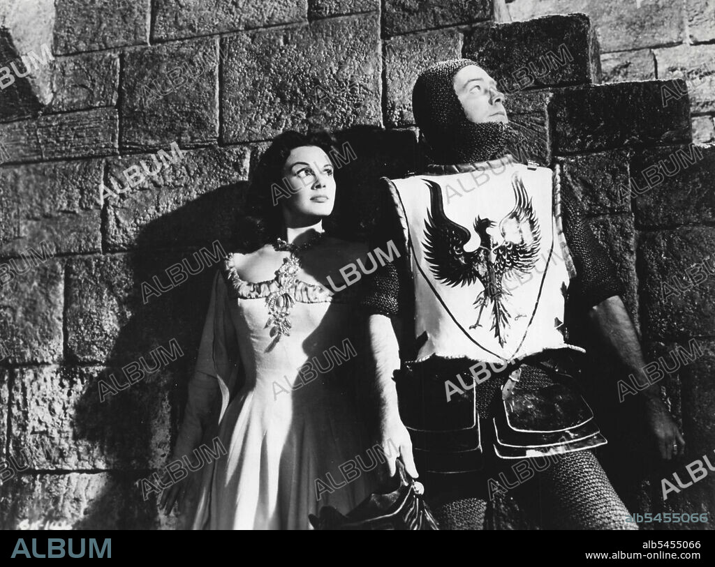 Columbia pictures presents A Warwick production in Color by Technicolor Alan Ladd in in The Black Knight co-starring Patricia Medina with Peter Cushing, Andre Morell, Harry Andrews. Story and screen play by Alec Coppel, Produced by Irving Allen and Albert R. Broccoll, Directed by Tay Garnett. May 27, 1955.