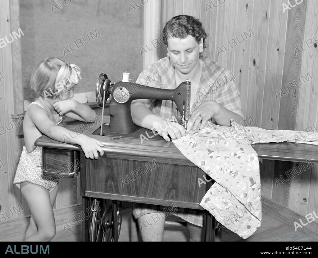 Housewife Using Sewing Machine,1940 - Album alb5407144