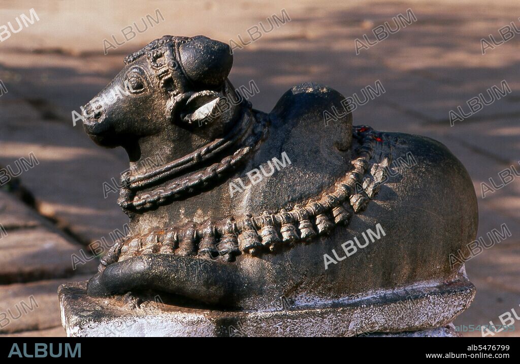 Nandi (Nandin) the Bull was the mythical mount of the god Shiva in Hindu mythology. The Virupaksha Temple (also known as the Pampapathi Temple) is Hampi's main centre of pilgrimage. It is fully intact among the surrounding ruins and is still used in worship. The temple is dedicated to Lord Shiva, known here as Virupaksha, as the consort of the local goddess Pampa who is associated with the Tungabhadra River. Hampi is a village in northern Karnataka state. It is located within the ruins of Vijayanagara, the former capital of the Vijayanagara Empire. Predating the city of Vijayanagara, it continues to be an important religious centre, housing the Virupaksha Temple, as well as several other monuments belonging to the old city.