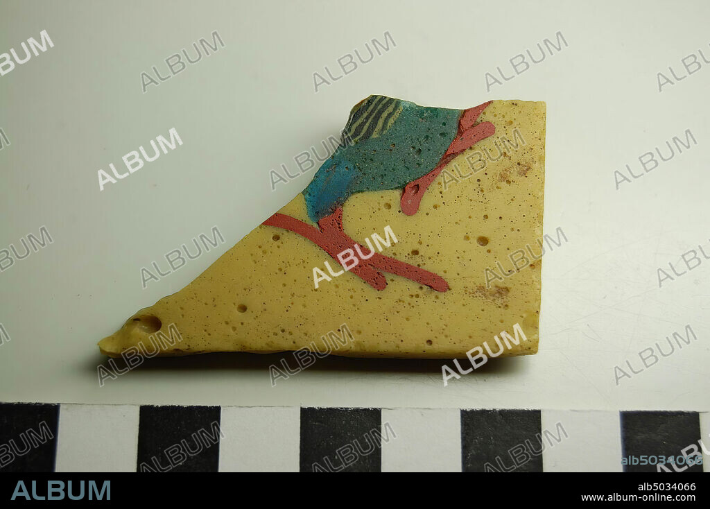 mosaic plate, bird, Fragment of a mosaic plate of yellow glass, decorated with the belly and legs of a bird in red, black and blue., Inlay, glass, 5,5 x 3,4 cm, Greek Roman Period, Roman imperial time 100 BC-100 AD, Egypt.