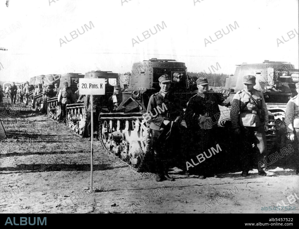 ***** now has 300,000 men, The full strength of her Army, under ARMS. The talks between Finland and Russia are being continued. 
***** some of Finland's tanks ready for *****. October 18, 1939. (Photo by Sport & General Press Agency, Limited.).