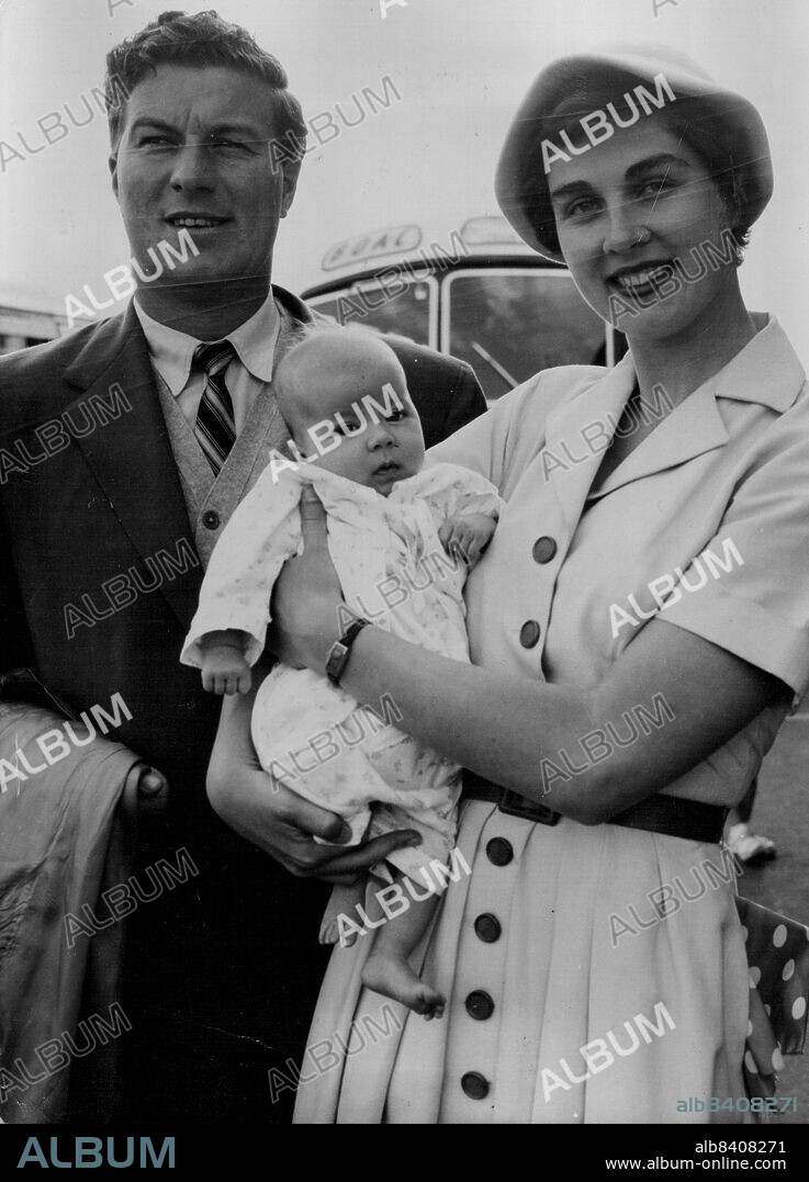 Open Champion Off At Last -- Australian golfer Peter Thomson with his wife Lois and the nine-weeks-old daughter Diedre, pictured at London airport tonight July 19. Thomason who won the British Open Golf title this month, had to cancel three previous bookings to America because The U.S. Authorities did not play in a series of tournaments in America and will be back in England in September. July 19, 1954. (Photo by Associated Press Photo).