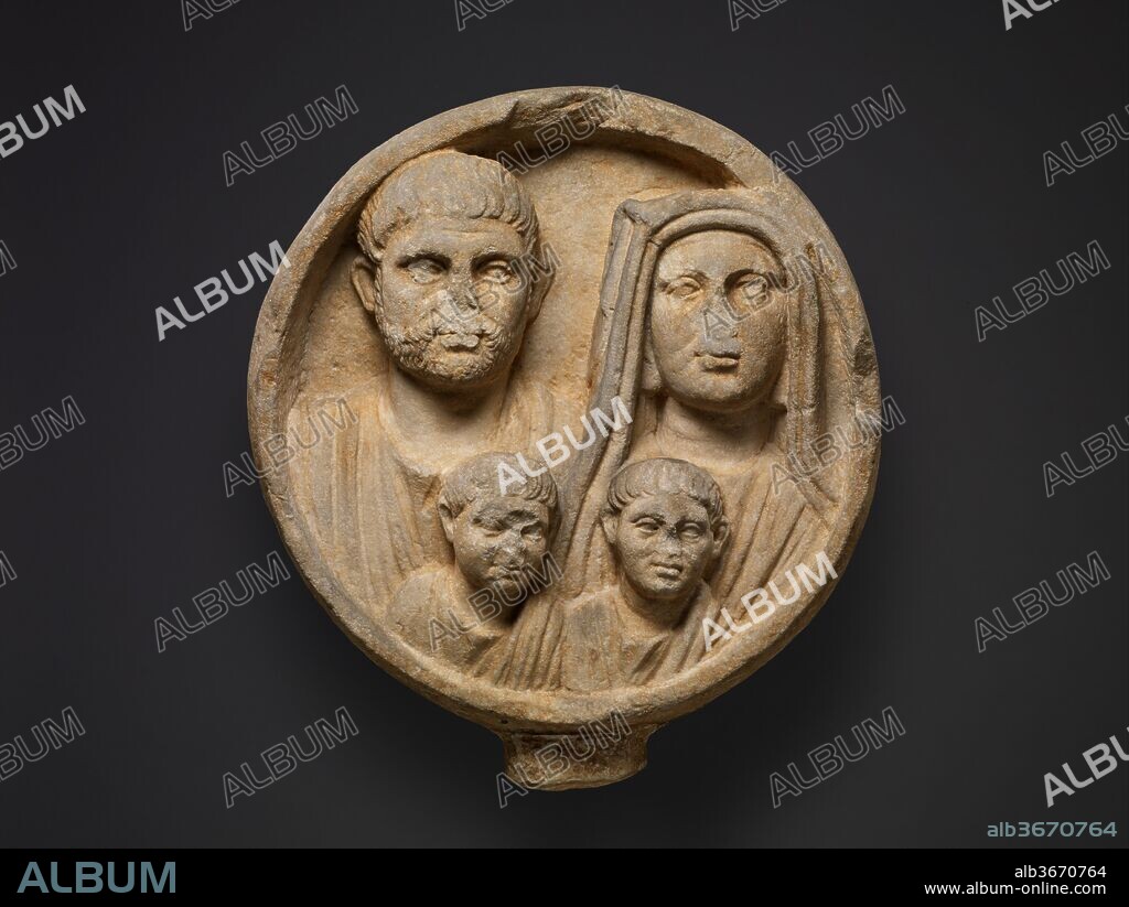 Marble funerary relief. Culture: Roman. Dimensions: H.: 25 1/4 in. (64.1 cm)
Other: 23 in. (58.4 cm). Date: 2nd-3rd century A.D..
Funerary reliefs in the shape of a circular tondo, depicting a man and a woman or, as in this case, the whole family, are known principally from Thrace, northern Greece, and the Danube provinces. Some are inscribed, but this example leaves the man, his wife, and his two sons unnamed.