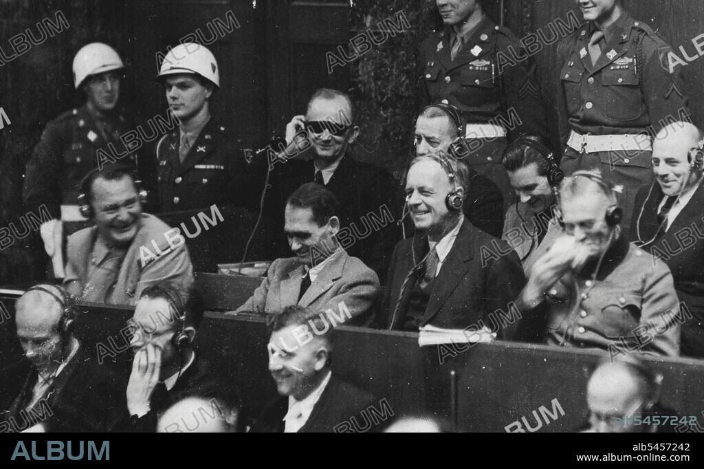 Laughter in the court -- With Goering leading the "Band" the Nazi war criminals broke out into Laughter during evidence given November 30. In front row are seen left to right Goering, Hess, Ribbentrop and Keith. Back row: Donetiz; Raeder; Schirach and Saukel. December 11, 1945. (Photo by Associated Press Photo).