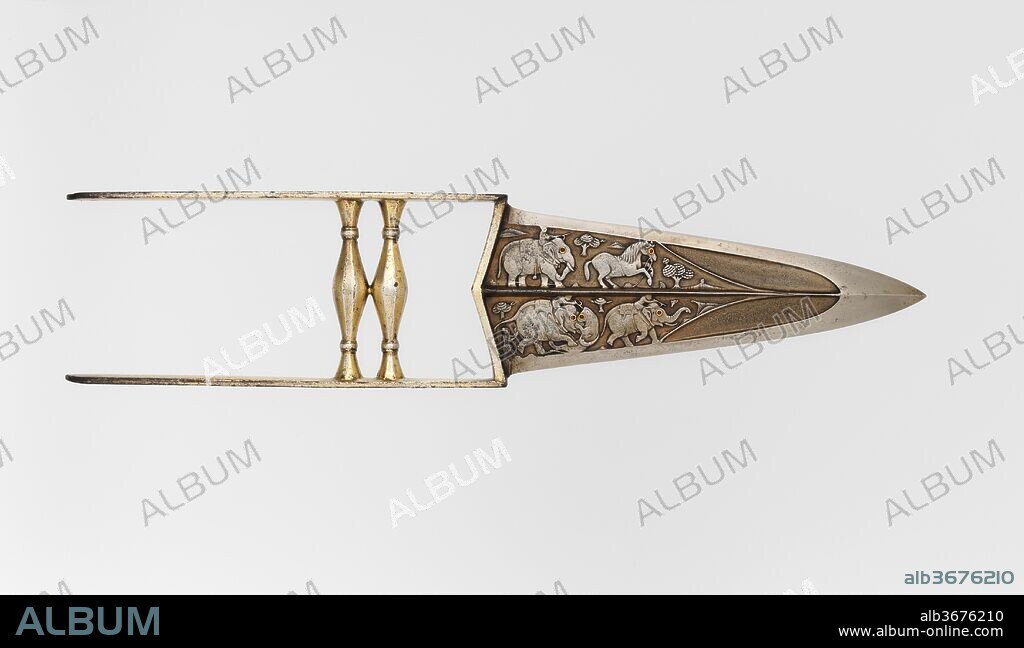 Punch Dagger (Katar) with Sheath. Culture: Indian, Mughal. Dimensions: L. 14 in. (35.6 cm); L. of blade 7 1/4 in. (18.4 cm);  W. 3 3/16 in. (8.1 cm); Wt. 15.2 oz. (430.9 g). Date: late 17th-18th century.
Daggers of this ancient Indian type are known variously as a <i>katar</i> (piercing dagger) or <i>jamadhar</i> (death tooth). Gripped in the fist, they were intended to deliver a deadly punching blow and were used in both war and the hunt. The blade of this example is notable for the delicately chiseled figures of elephants and horses engaged in the hunt.