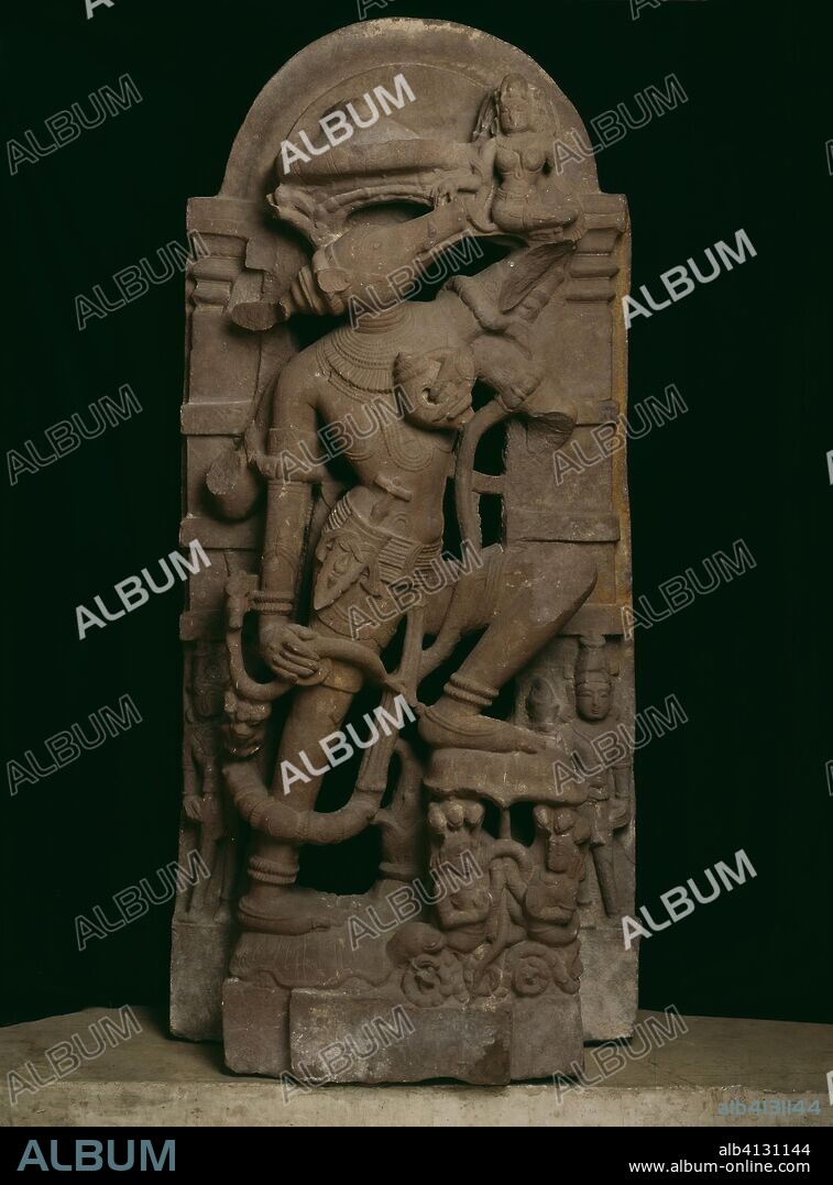 Boar Incarnation of God Vishnu (Varaha) Lifting the Earth Goddess Bhudevi. India; Rajasthan. Date: 1001-1100. Dimensions: 132.1 x 58.5 x 29.3 cm (52 x 23 x 11 1/2 in.). Red sandstone. Origin: Rajasthan.