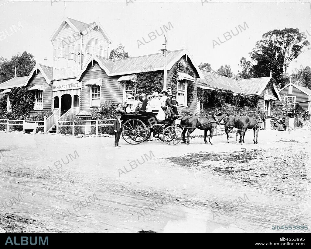 Negative - People in Charabanc Outside Warrandyte Hotel, Victoria, 1909, A group of people in a horse-drawn charabanc in front of the Warrandyte Hotel.