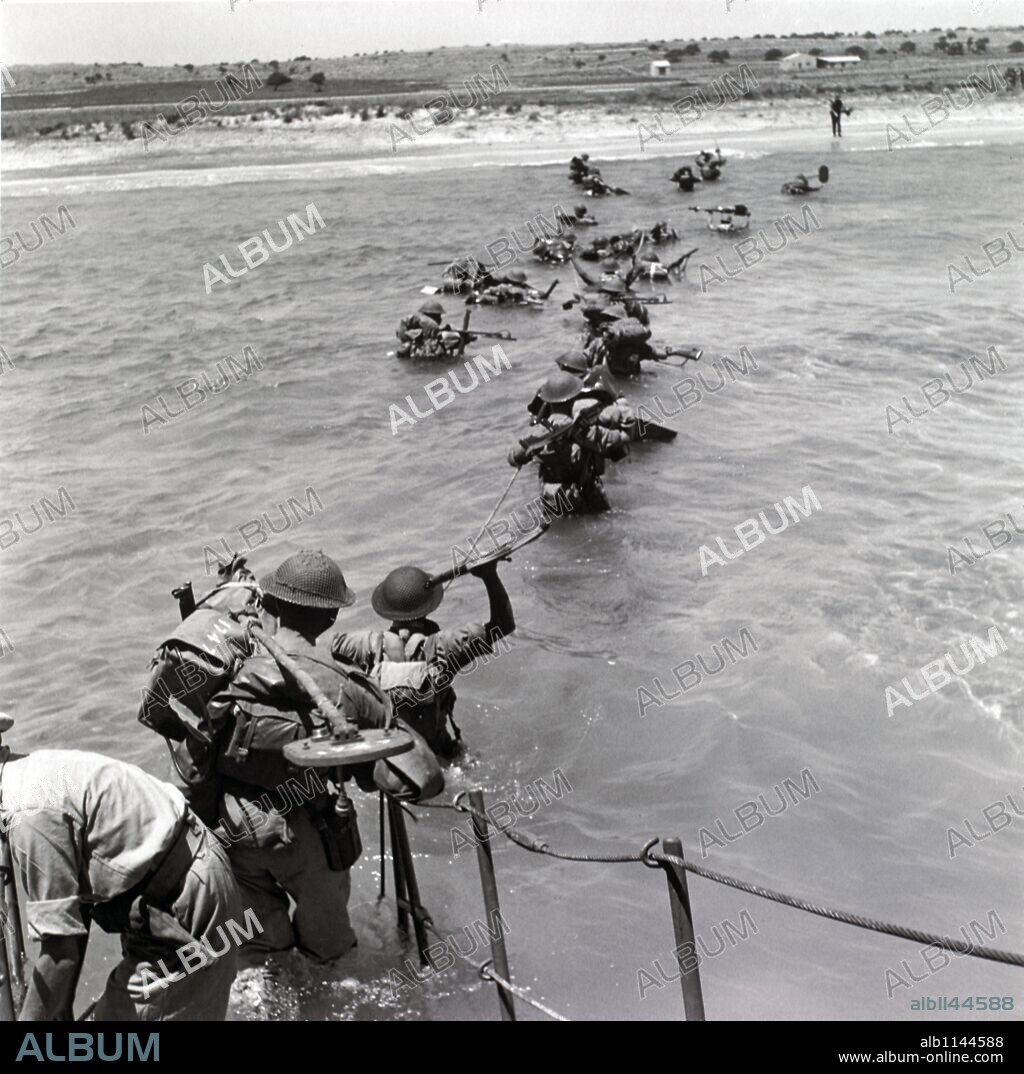 Men of the 5th Bn Seaforth Highlanders wading ashore in Sicily.