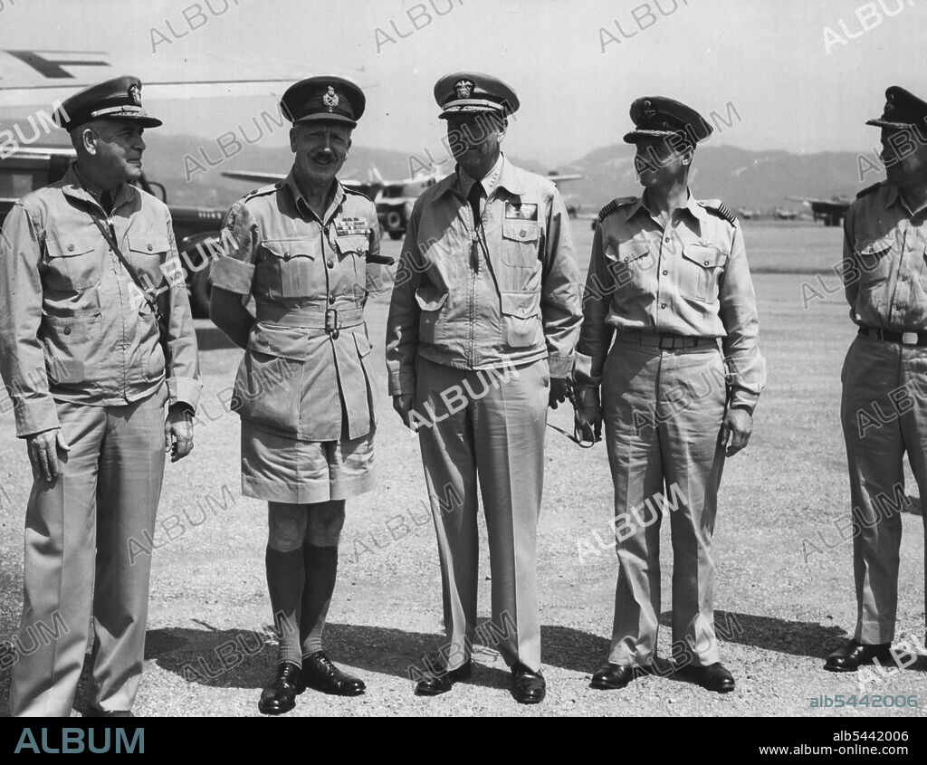 Senior United Nations commanders exchanged courtesies during a recent meeting at an Australian air base in southern Japan. From left, Vice-Admiral Charles T. Joy, Cornav FE, Lt. General Sir Horace Robertson. C-in-C BCOF and Administrative Commander of British Commonwealth Forces in Korea, Admiral Arthur W. Radford Commander-in-Chief, US Pacific Fleet, Group-Captain A.D. Charlton, Commanding 919 (C) Wing, RAAW, and Group-Captain R.A.C. Bardlay, Air Adviser, UK Liaison Mission in Japan. June 1, 1951.