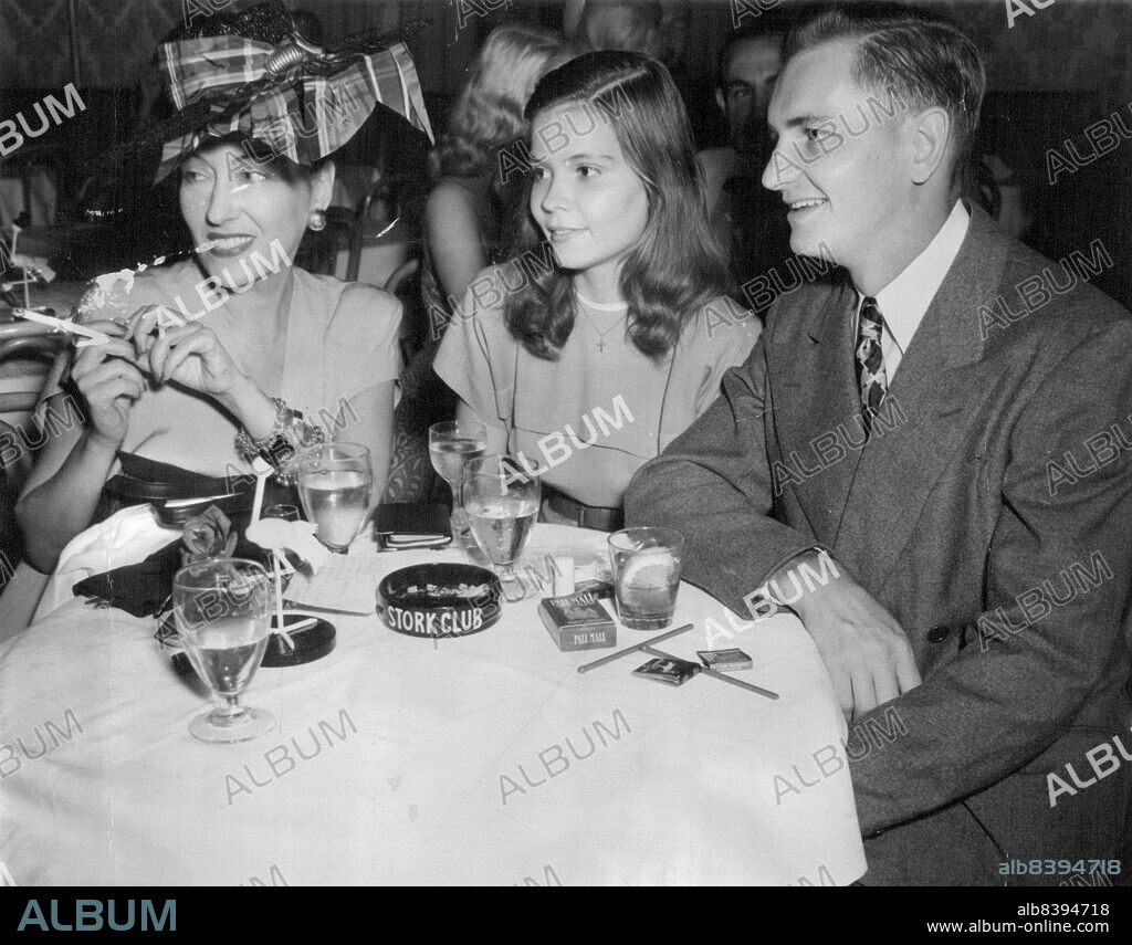 Gloria's Glory - Gloria Swanson, star of the silent films, holds a family reunion with her daughter and son, Michelle farmer Swanson and Joseph Swanson, at the stork club here. August 26, 1947. (Photo by Wide World Photos).