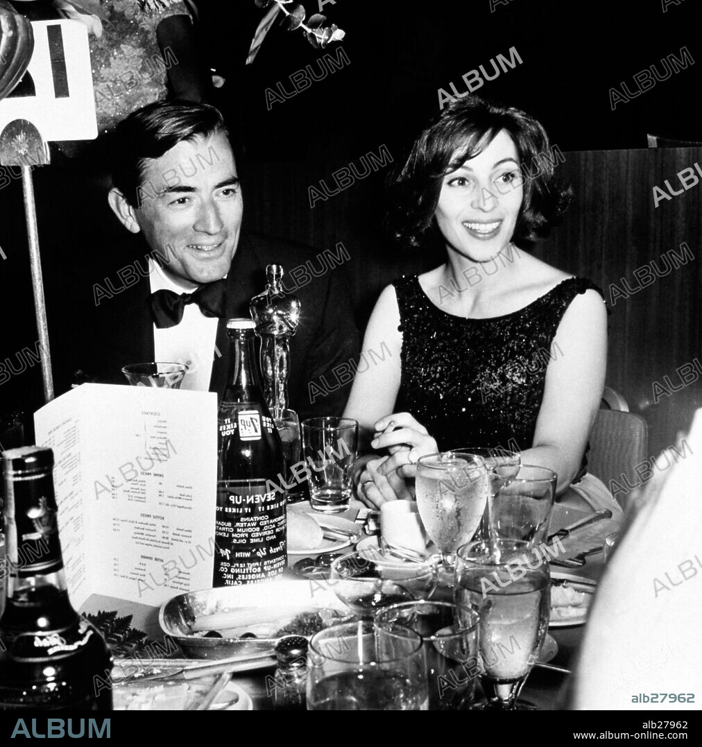 GREGORY PECK in FILM HISTORY: OSCARS. The 35th Academy Awards / 1963.
Gregory Peck sits with his wife Veronique and the Oscar he won for Best Actor in 'To Kill a Mockingbird'. 1963