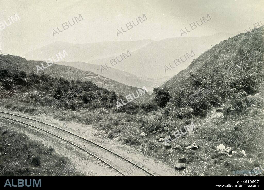 'Ascending the Mexican Cordillera, or Eastern Sierra Madre: The Railway Is Seen In The Valley Far Below', 1919. From "Mexico", by C. Reginald Enock, F.R.G.S. [Charles Scribner's Sons, New York, 1919].